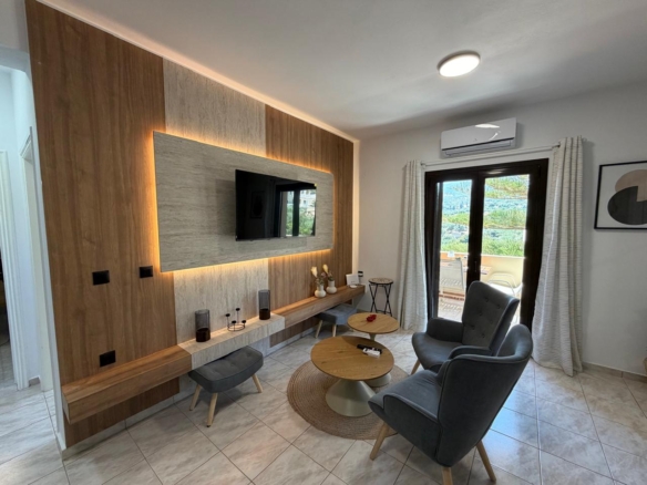 First-floor fully renovated two-bedroom apartment with a shared pool in Stylos